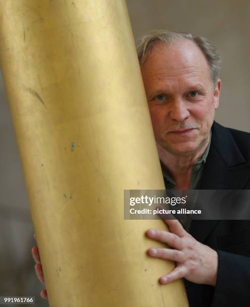 The actor, musician and writer Ulrich Tukur poses for the camera in the course of an interview in the gold hall of the Hessische Rundfunk in...