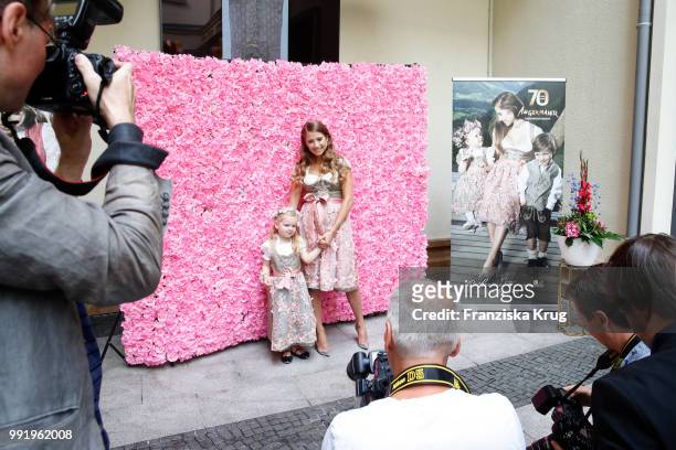 Cathy Hummels and child model Olivia pose at the Cathy Hummels by Angermaier collection presentation at Titanic Hotel on July 5, 2018 in Berlin,...