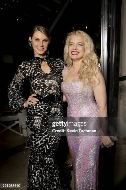 Angela Lindvall and Angela Ismailos attend the amfAR Paris Dinner at The Peninsula Hotel on July 4, 2018 in Paris, France.