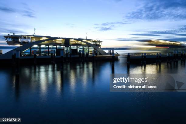 Car ferry is on its way on the Bodensee to Konstanz right before nightfall in front of Meersburg, Germany, 21 November 2017. Photo: Felix Kästle/dpa