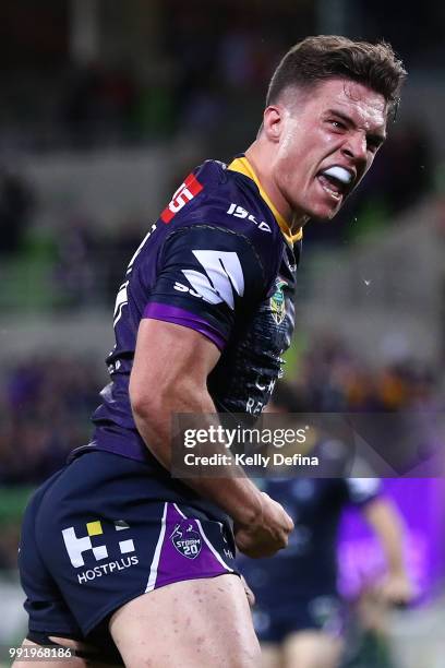 Brodie Croft of the Storm celebrates his try during the round 17 NRL match between the Melbourne Storm and the St George Illawarra Dragons at AAMI...
