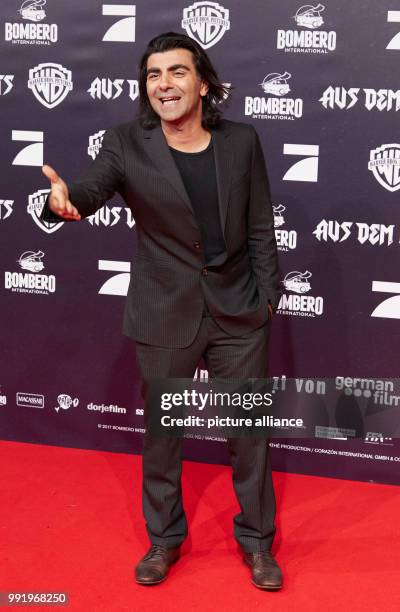 The director Fatih Akin arrives at the premiere of the movie 'Aus dem Nichts' at the Cinemaxx in Hamburg, Germany, 21 November 2017. The film will be...