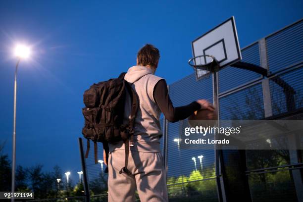 outdoor urban basketball training session for individual middle aged man - sports training drill stock pictures, royalty-free photos & images