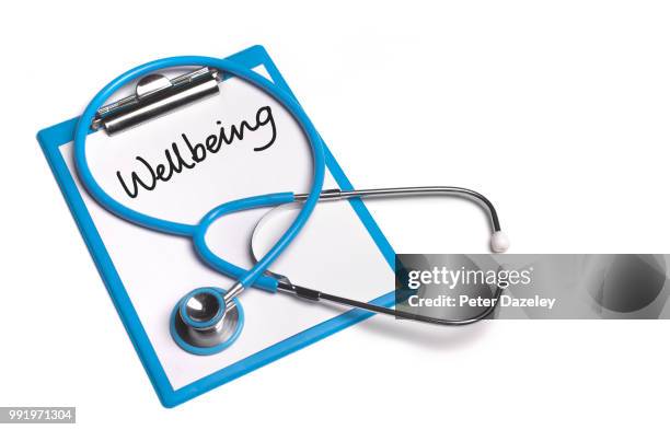 wellbeing clipboard with stethoscope - peter dazeley stock pictures, royalty-free photos & images