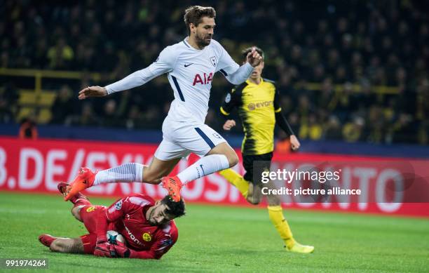 Dortmund's goalkeeper Roman Buerki is injured by Tottenham's Fernando Llorente during the Champions League soccer match between Borussia Dortmund and...