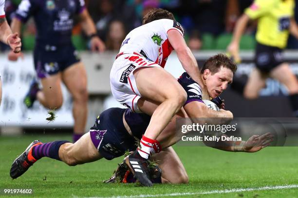 Ryan Hoffman of the Storm scores a try during the round 17 NRL match between the Melbourne Storm and the St George Illawarra Dragons at AAMI Park on...