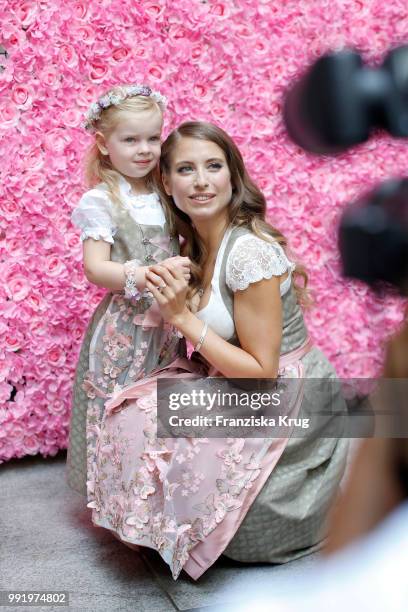 Cathy Hummels and child model Olivia pose at the Cathy Hummels by Angermaier collection presentation at Titanic Hotel on July 5, 2018 in Berlin,...