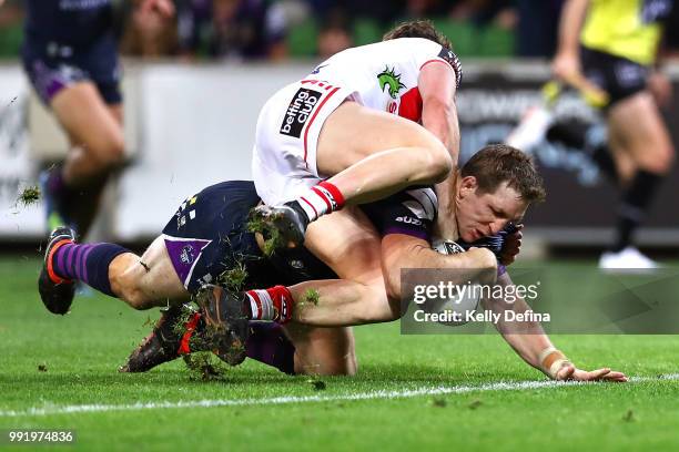 Ryan Hoffman of the Storm scores a try during the round 17 NRL match between the Melbourne Storm and the St George Illawarra Dragons at AAMI Park on...