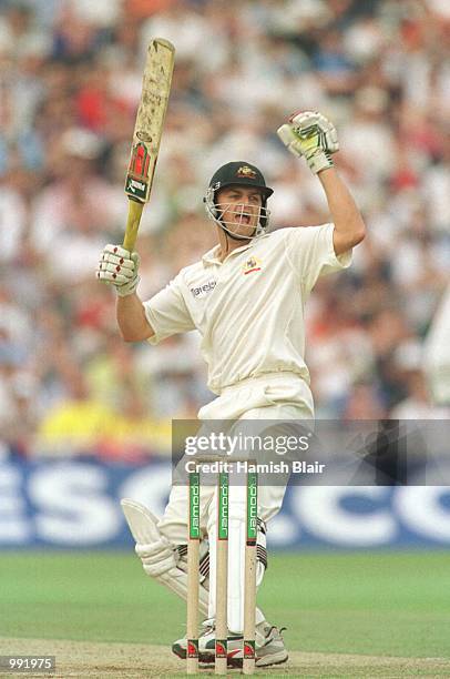 Adam Gilchrist of Australia celebrates his 150 not out during the third day of the England v Australia first test match at Edgbaston, Birmingham....