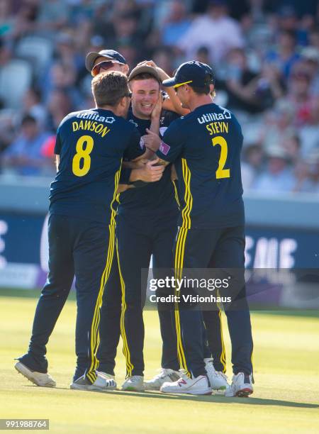 Mason Crane of Hampshire is congratulated by his team mates after running out Alex Blake of Kent during the Royal London One-Day Cup match between...