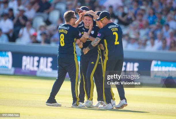 Mason Crane of Hampshire is congratulated by his team mates after running out Alex Blake of Kent during the Royal London One-Day Cup match between...