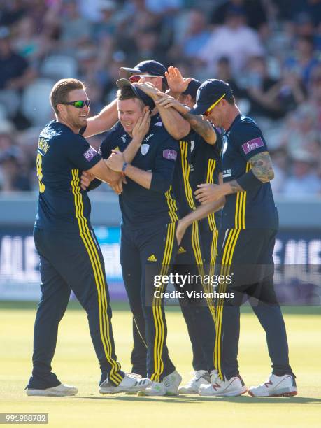 Mason Crane of Hampshire is congratulated by his team mates after running out Alex Blake of Kent during the Royal London One-Day Cup match between...