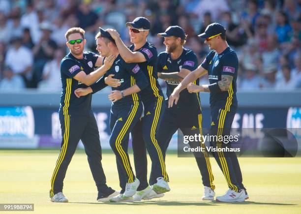 Mason Crane of Hampshire is congratulated by his team mates after running out Alex Blake of Kent during the Royal London One-Day Cup match between...