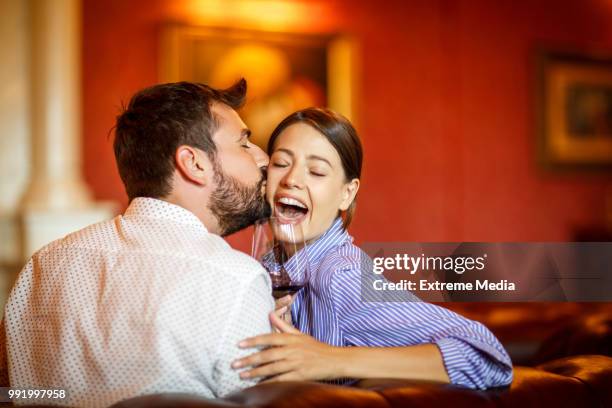 couple on first class trip - chesterfield sofa stock pictures, royalty-free photos & images