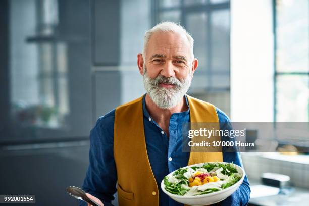 portrait of cheerful senior man with fresh homemade salad - proud old man stock pictures, royalty-free photos & images