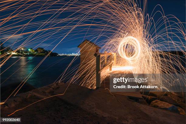 play with fire. - burning steel wool firework stock pictures, royalty-free photos & images