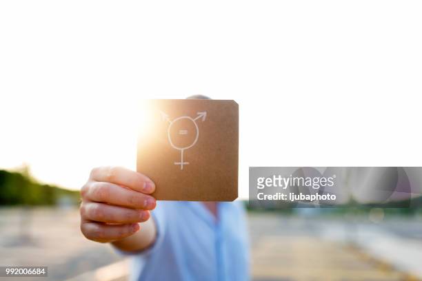 transgender symbol on piece of paper - transgender awareness week stock pictures, royalty-free photos & images
