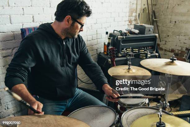 musician playing drum and cymbals in recording studio - drummer stock pictures, royalty-free photos & images