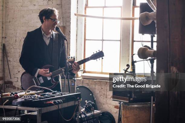 musician rehearsing for a performance - guitarist band stock pictures, royalty-free photos & images