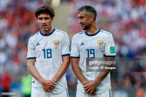 Yury Zhirkov of Russia and Alexander Samedov of Russia look on during the 2018 FIFA World Cup Russia match between Spain and Russia at Luzhniki...