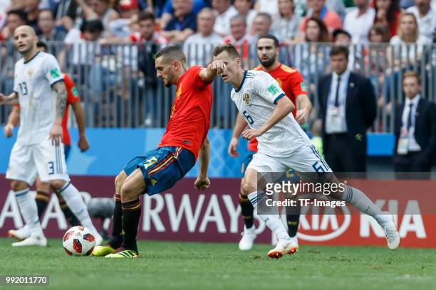 Koke of Spain and Denis Cheryshev of Russia battle for the ball during the 2018 FIFA World Cup Russia match between Spain and Russia at Luzhniki...