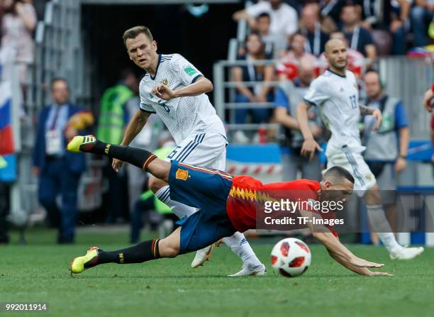 Denis Cheryshev of Russia and Koke of Spain battle for the ball during the 2018 FIFA World Cup Russia match between Spain and Russia at Luzhniki...
