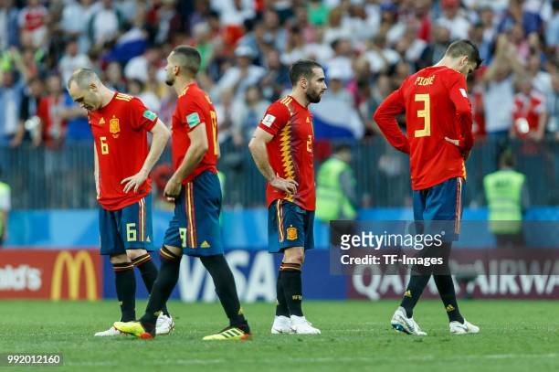 Andres Iniesta of Spain, Rodrigo of Spain, Dani Carvajal of Spain and Gerard Pique of Spain look on during the 2018 FIFA World Cup Russia match...