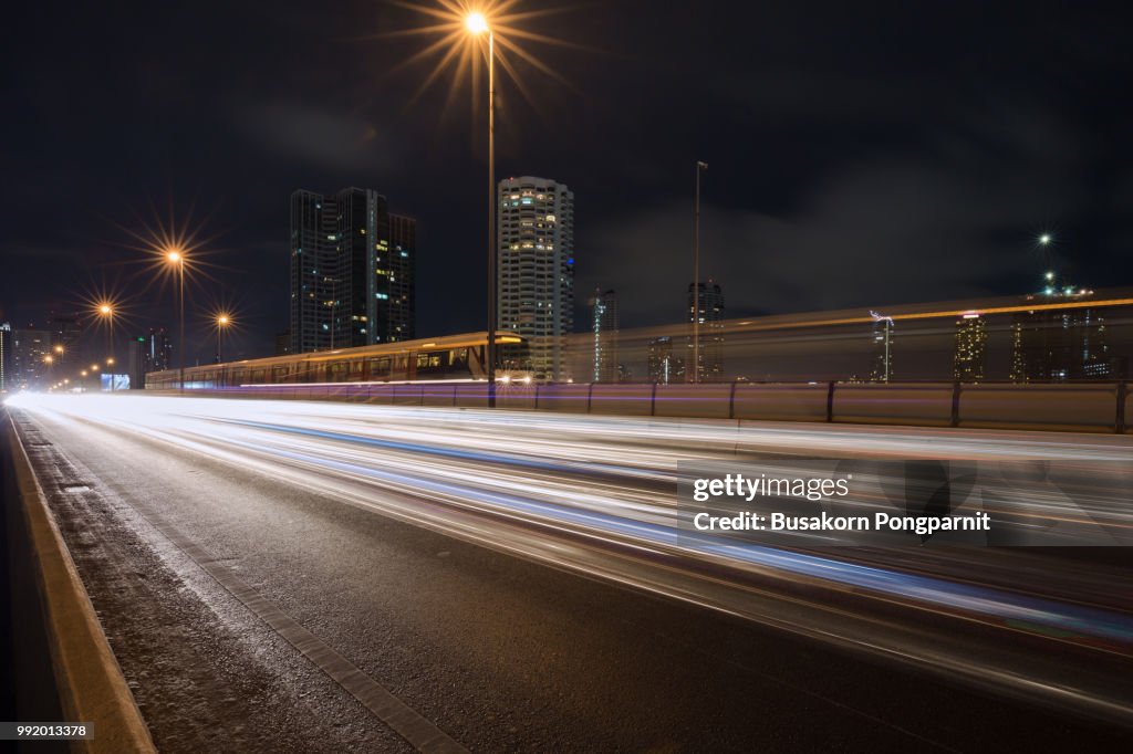 Blurred Tail Lights And Traffic Lights On Motorway