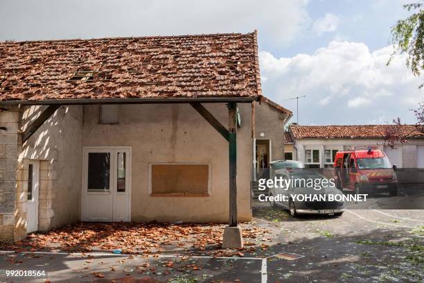 Damaged roof tiles litter the ground in the village of Saint-Sornin on July 5 after violent hailstorms ripped through the area some 80kms north-west...