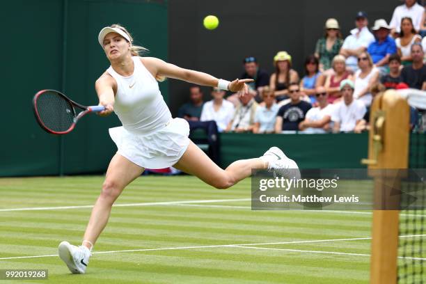 Eugenie Bouchard of Canada returns a shot to Ashleigh Barty of Australia during their Ladies' Singles second round match on day four of the Wimbledon...