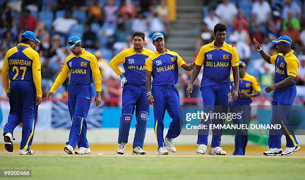 Sri lankan bowler Thissara Perera is congratulated after bowling out English batsmen Michael Lumb during the ICC World Twenty20 first semifinal match...