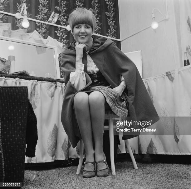English singer and actress Cilla Black pictured in a dressing room backstage after announcing her engagement to her future manager Bobby Willis on...