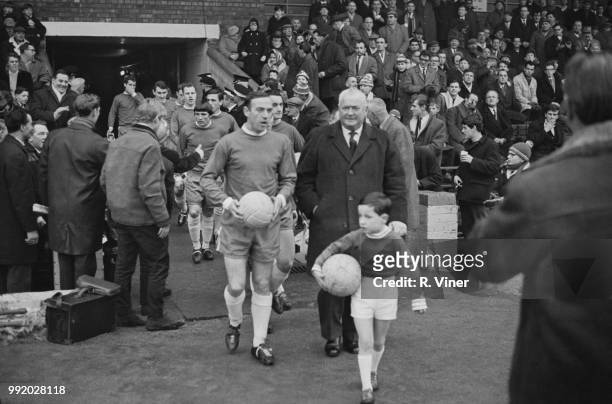 Scottish professional footballer and captain of Birmingham City, Ron Wylie leads out the team with former Birmingham City centre forward Joe Bradford...
