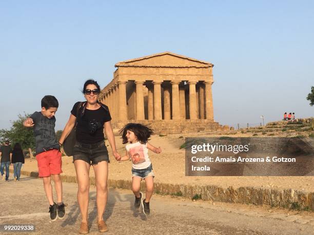 mother and children in valley of the temples. agrigento, italy. - 5th century bc stock pictures, royalty-free photos & images