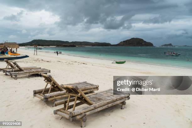 bamboo beach chairs on the tanjung aan beach in kuta in south lombok, indonesia - didier marti stock pictures, royalty-free photos & images