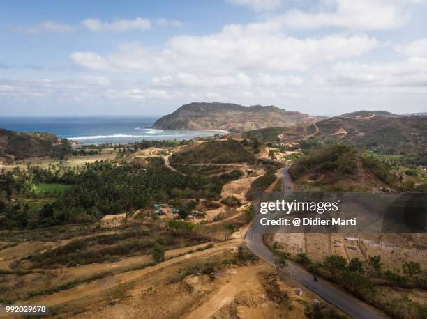 stunning aerial view of the countryside around kuta with the are guling beach in the background in south lombok in indonesia - didier marti stock pictures, royalty-free photos & images
