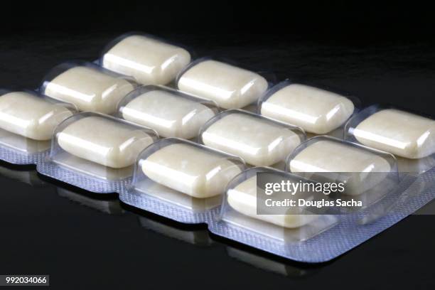 nicotine chewing gum on a black background - bubble gum stock pictures, royalty-free photos & images