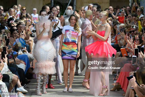 Fashion designer Marina Hoermanseder is applauded by models after her show during the Berlin Fashion Week Spring/Summer 2019 at ewerk on July 5, 2018...