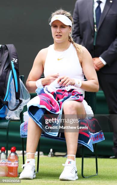 Eugenie Bouchard of Canada looks on between games during her Ladies' Singles second round match Ashleigh Barty of Australia on day four of the...