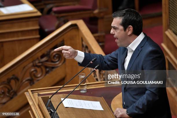 Greece's Prime Minister Alexis Tsipras gestures as he addresses lawmakers at parliament in Athens on July 5 during a debate on the economy and the...