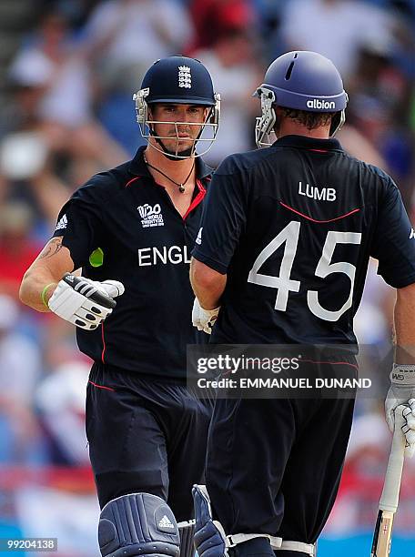 English batsmen Kevin Pietersen and Michael Lumb celebrate a boundary during the ICC World Twenty20 first semifinal match between Sri Lanka and...