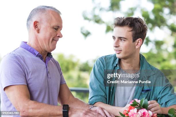 two men in conversation - androgynous boys stock pictures, royalty-free photos & images