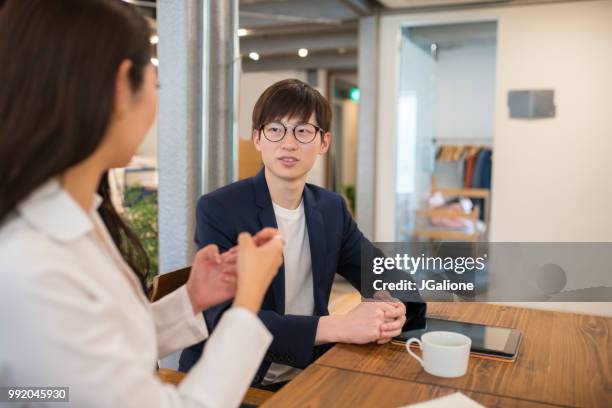 colleagues meeting in a modern office - jgalione stock pictures, royalty-free photos & images