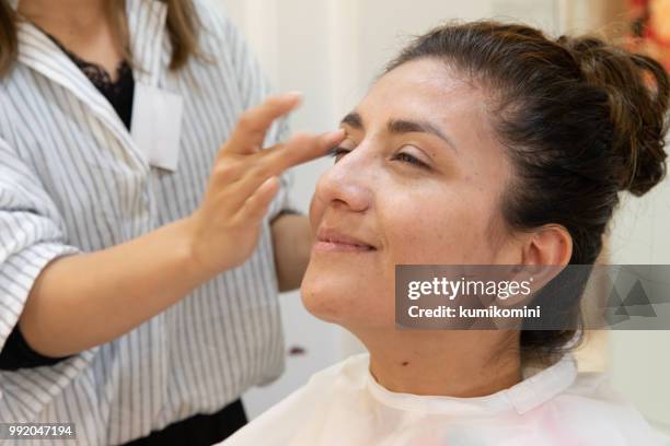 latin woman at kimono beauty salon - kumikomini stock pictures, royalty-free photos & images