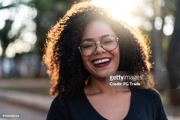 beautiful curly hair woman - toothy smile stock pictures, royalty-free photos & images