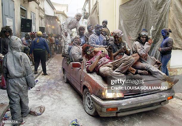 Participants of the colourful flour-war drive through the town during the celebrations of the Clean Monday, which marks the end of carnival and the...