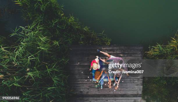 enjoying the party - night picnic stock pictures, royalty-free photos & images