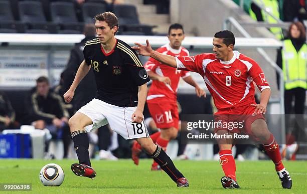 Stefan Reinartz of Germany and Roderick Briffa of Malta compete for the ball during the international friendly match between Germany and Malta at...