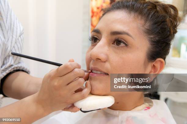 latin woman at kimono beauty salon - kumikomini stock pictures, royalty-free photos & images