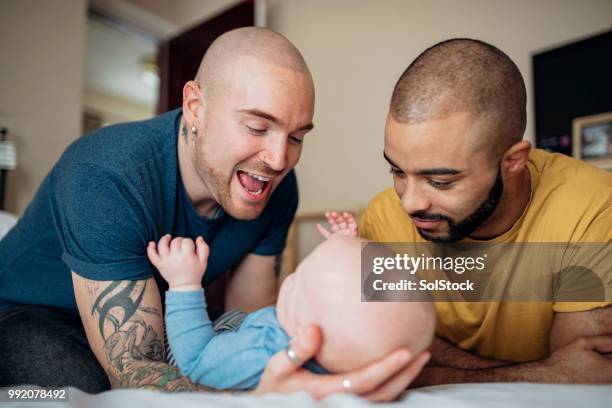 father's and son playing - casal gay imagens e fotografias de stock